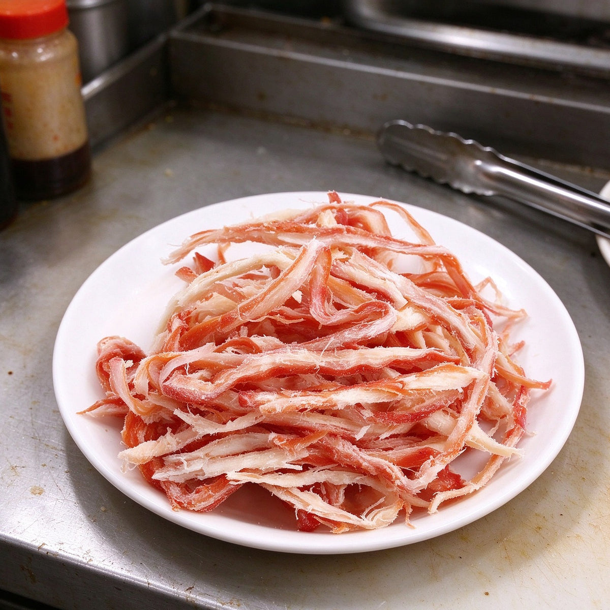 Red and white crab meat strands piled on a plate